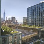 The Walt Disney Company's New York headquarters campus with rooftop terraces, with the lower Manhattan skyline and One World Trade Center in the background