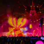 World of Color - Season of Light at Disney California Adventure, with colorful fountains in Paradise Bay and Mickey's face lit on the Pixar Pal-A-Round