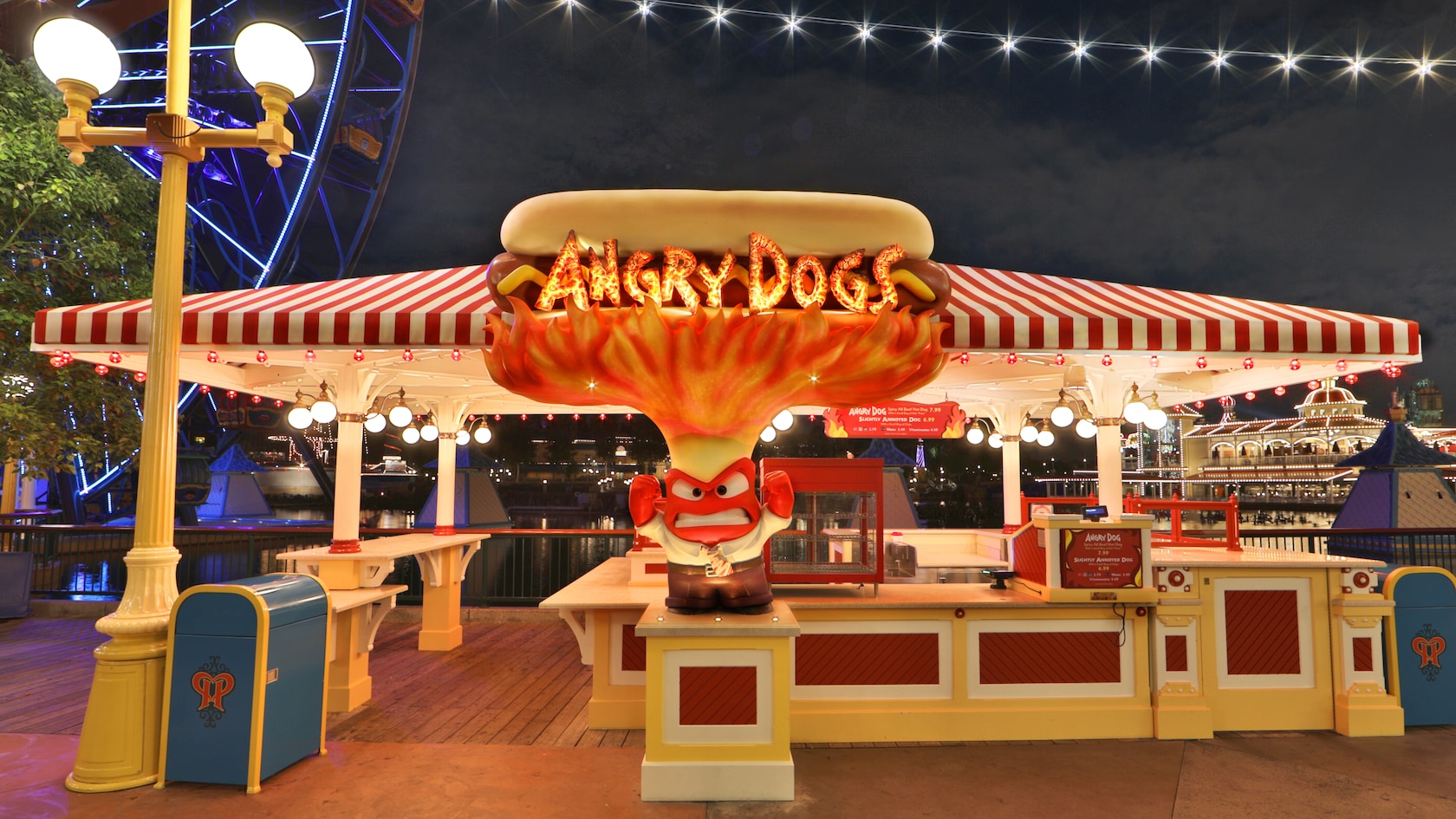 The sign for Angry Dogs features a person clenching his teeth with a flaming hotdog overhead