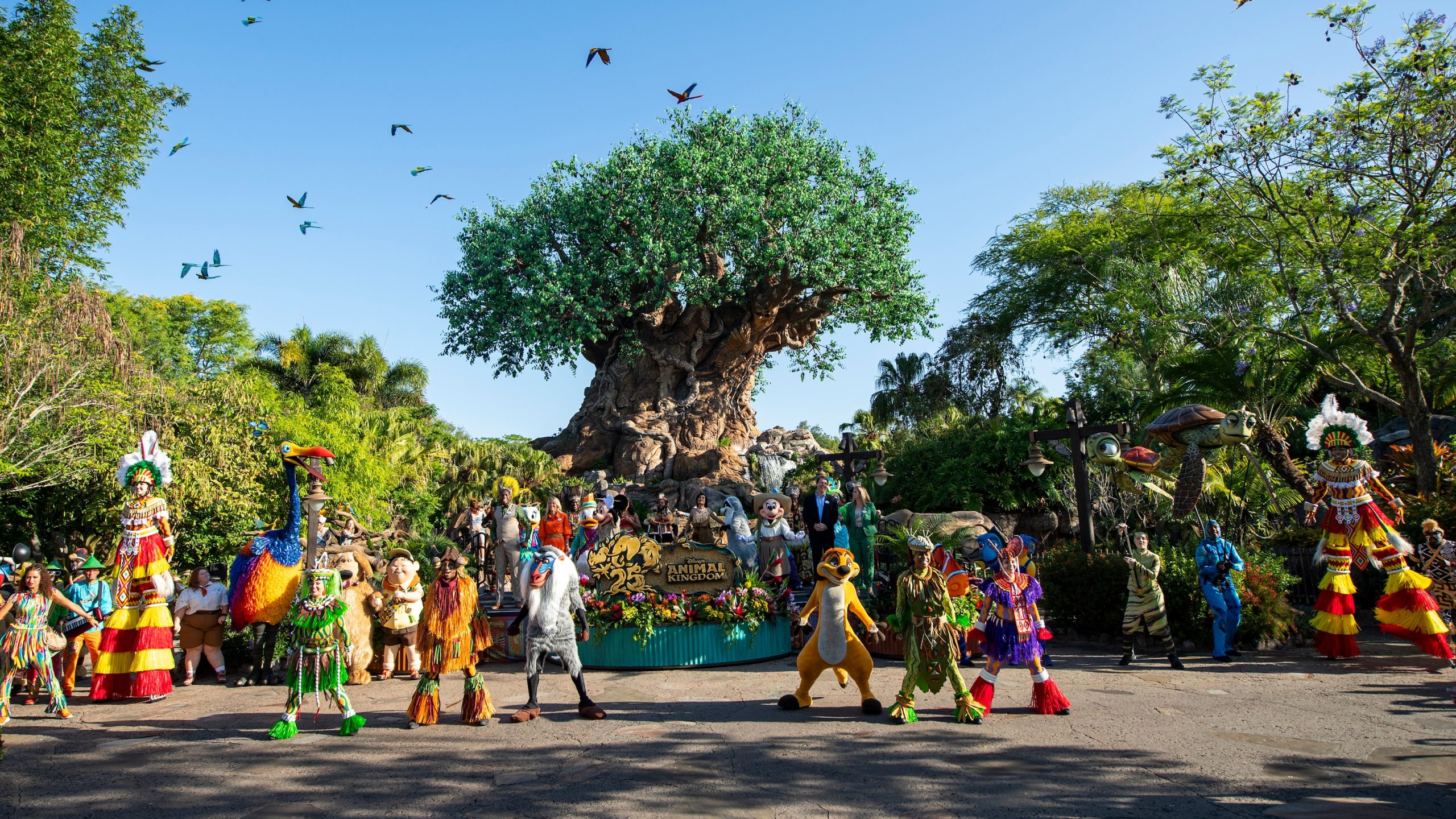 Characters and performers gathered in front of the Tree of Life at Disney's Animal Kingdom for the park's 25th anniversary