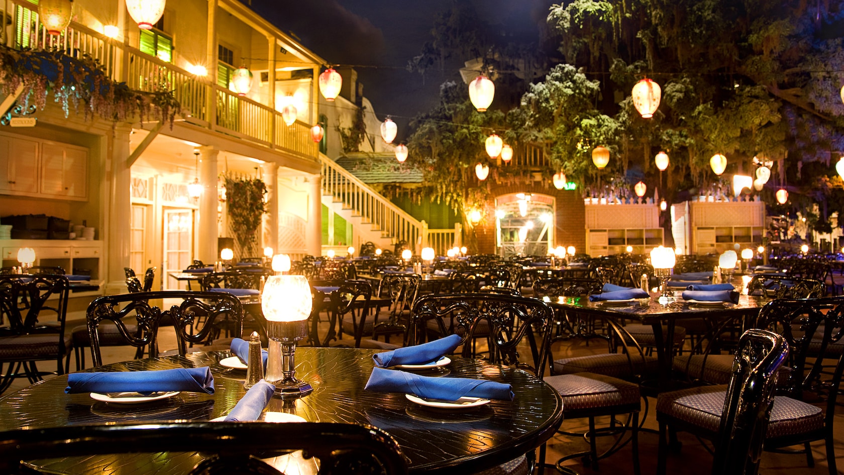 Dining tables are under perpetual 'twilight' at the Blue Bayou restaurant