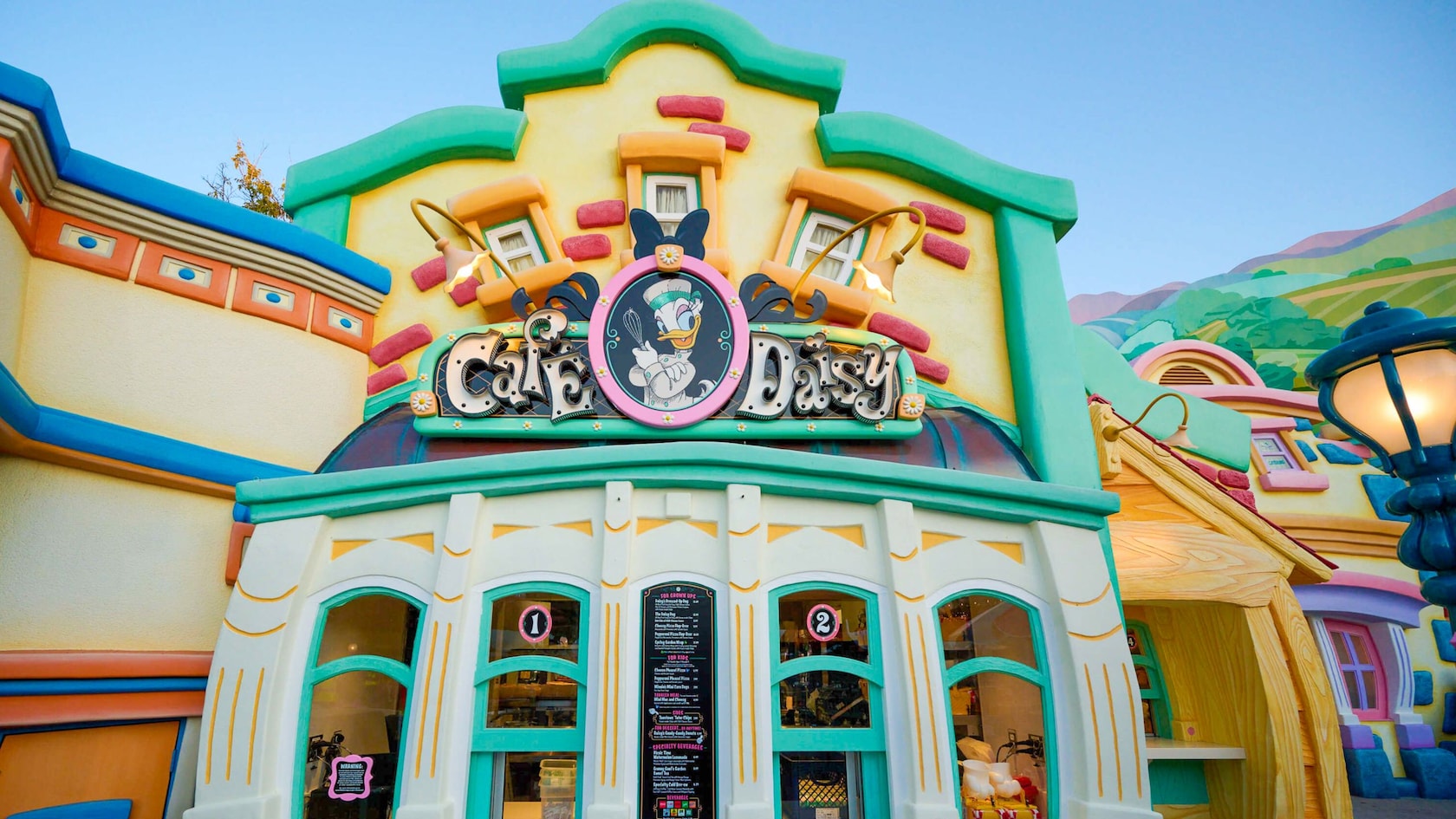 Café Daisy featuring Daisy Duck on a sign at Centoonial Park in Mickey’s Toontown