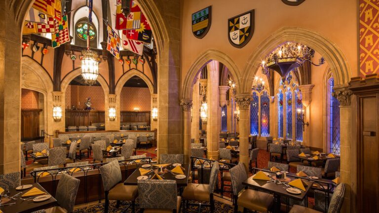 Cinderella’s Royal Table in Magic Kingdom park, featuring stone archways and stained glass windows