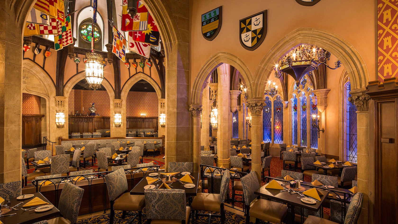 Cinderella’s Royal Table in Magic Kingdom park, featuring stone archways and stained glass windows
