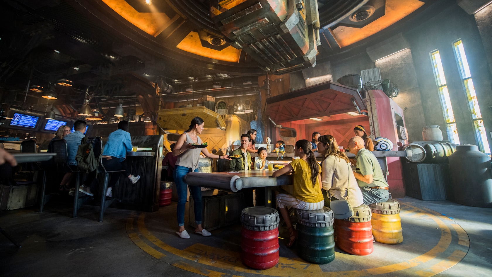A large group eating at the Black Spire Outpost eatery at Star Wars Galaxy's Edge