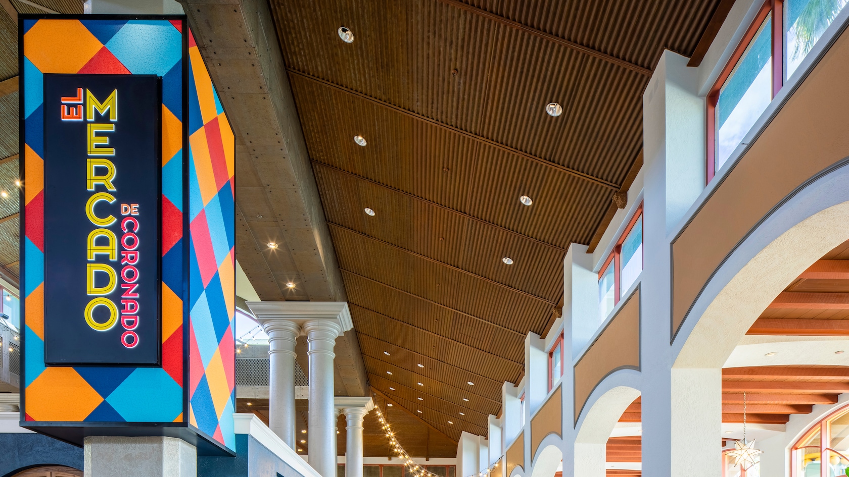 A food court with a sign that reads El Mercado de Coronado