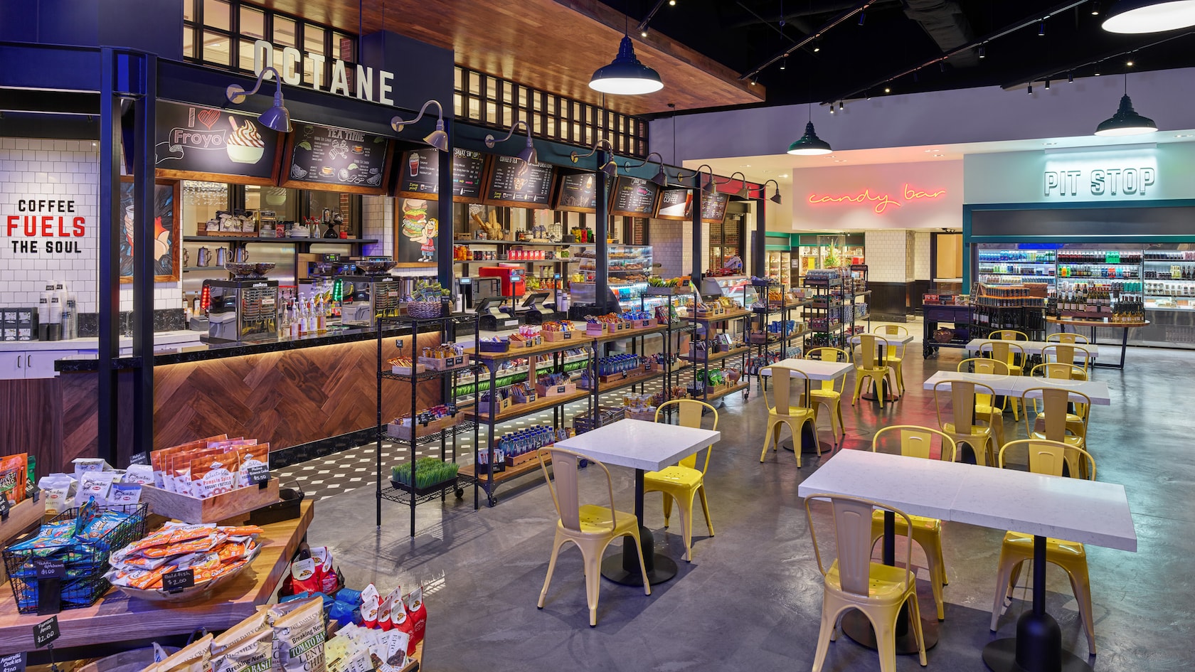 A quick service dining location with stations for ordering snack and beverages and tables with chairs for two or four people
