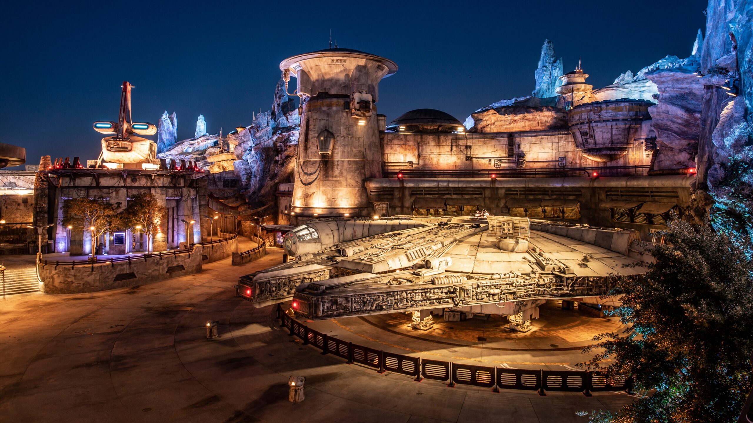 The Millennium Falcon at night in Star Wars: Galaxy's Edge at Disneyland Park