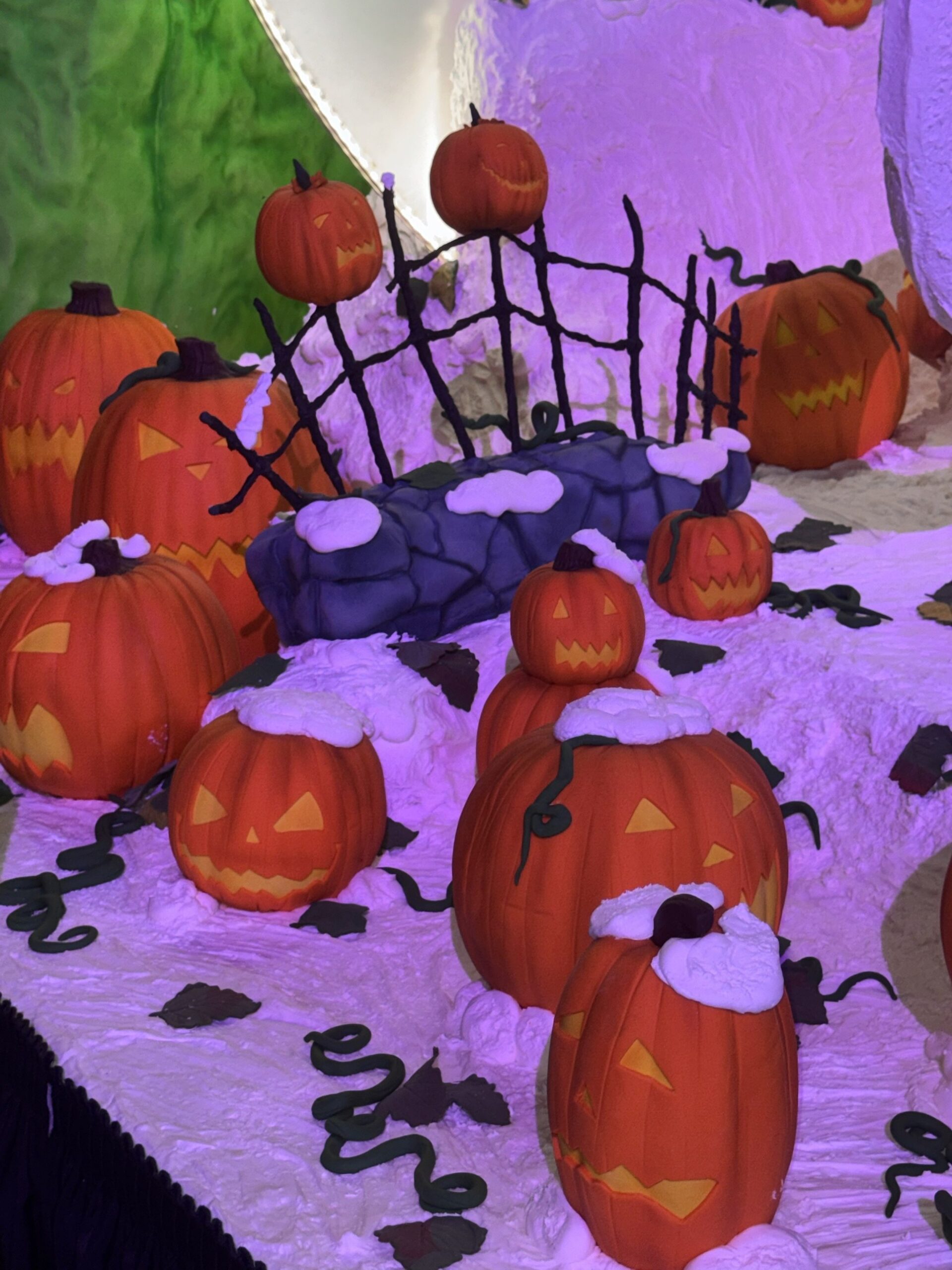 Confection jack-o'-lanterns, a stone wall and a twisted fence on the Nightmare Before Christmas display at the Grand Californian