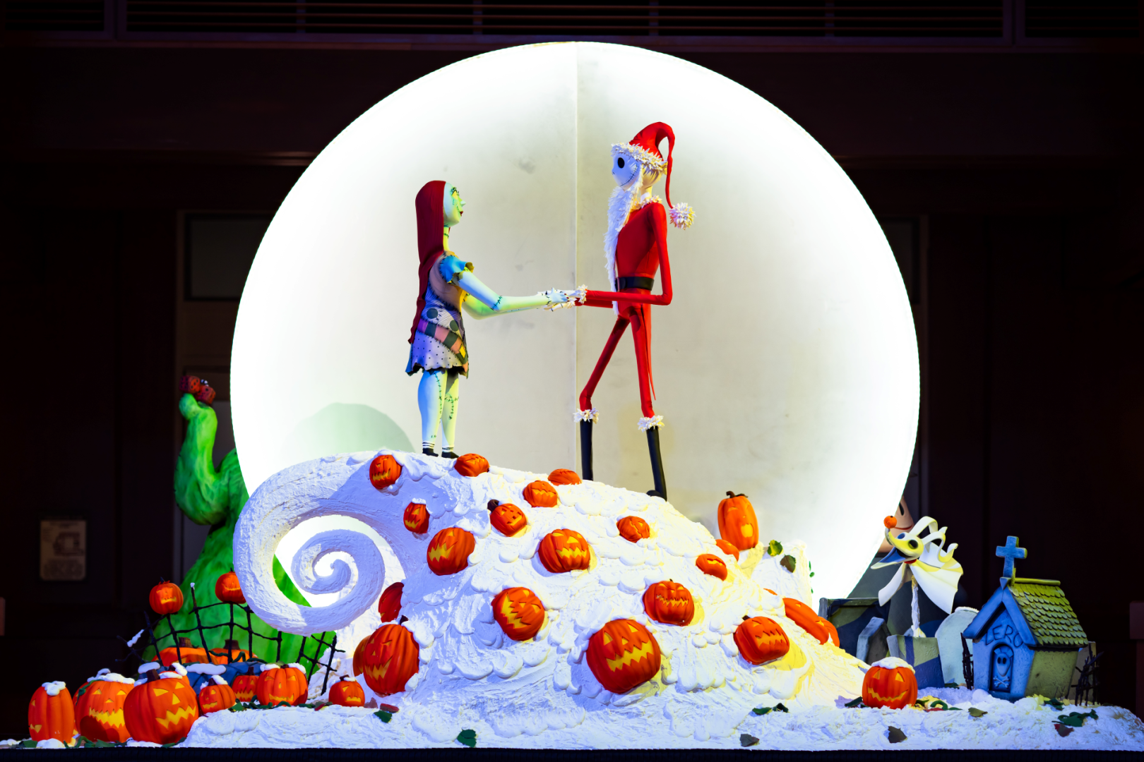 Jack Skellington in his Sandy Claws suit and Sally on Spiral Hill with Zero and jack-o'-lanterns in the Nightmare Before Christmas confection at Disney's Grand Californian Hotel and Spa