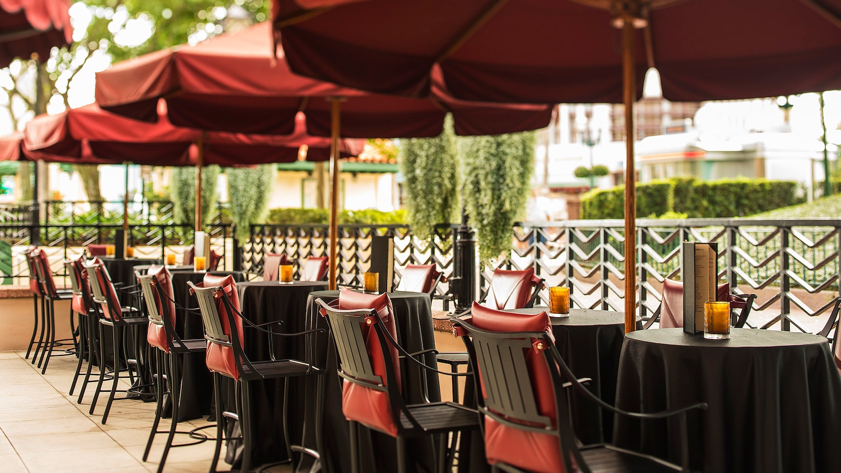 The Brown Derby Lounge Patio Reopens At Hollywood Studios With A Red Awning Covering Every Table