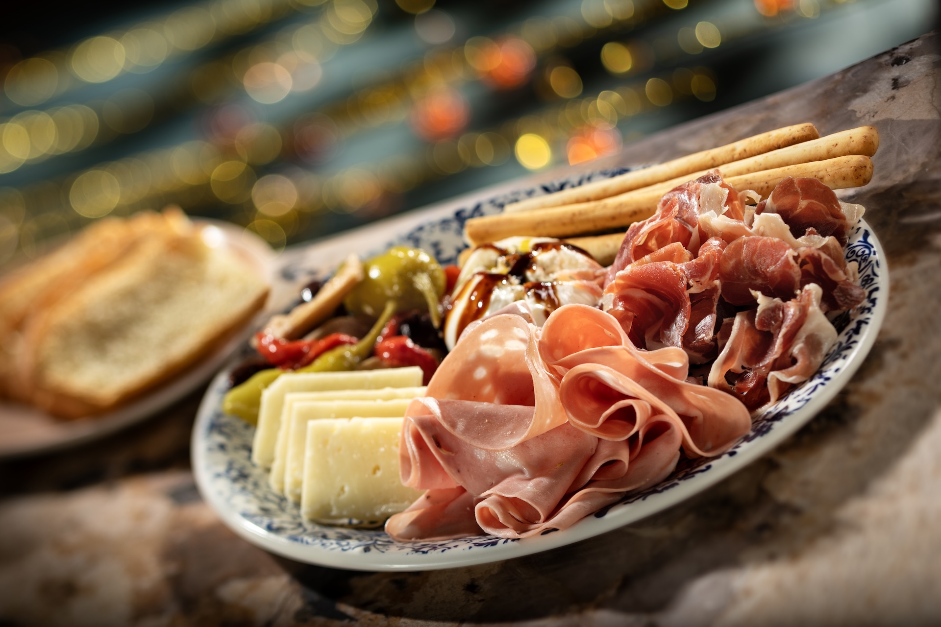 The Hurly-Burly Antipasto plate with sliced meats, Burrata, cheese, marinated vegetables and breadsticks