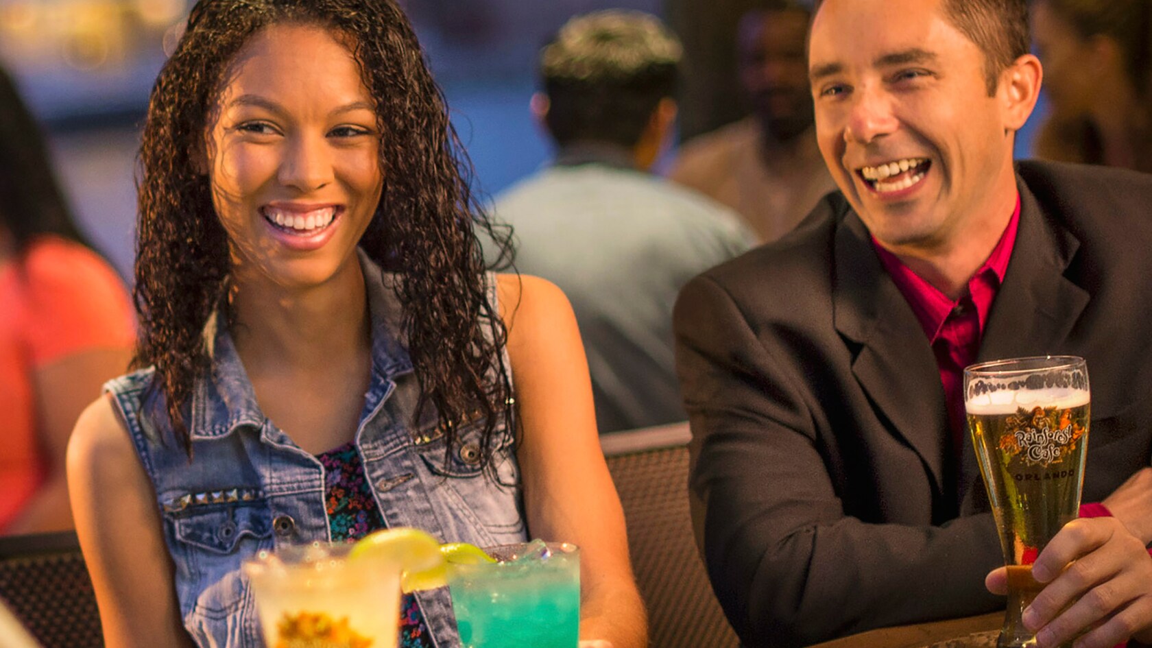 Friends enjoy cocktails at the Lava Lounge inside the Rainforest Cafe