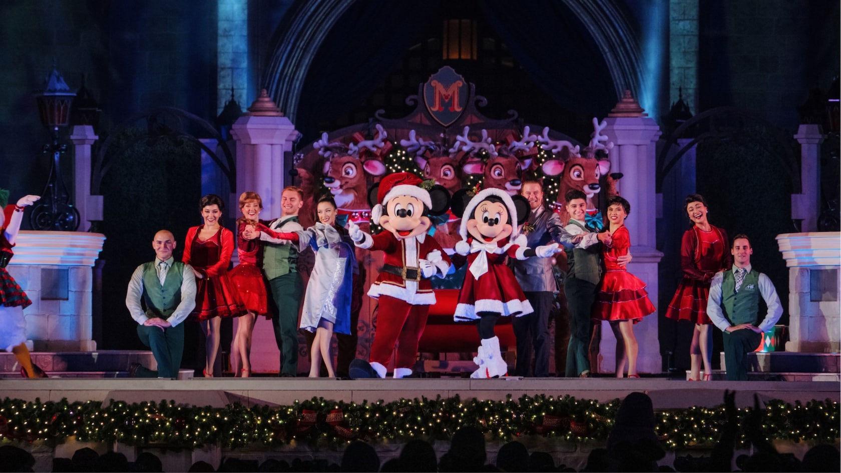 Mickey and Minnie in holiday outfits on the Cinderella Castle stage during Mickey's Very Merry Christmas Party at Magic Kingdom (Disney)