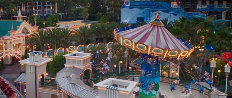 Paradise Gardens Park at dusk, with the Silly Symphony Swings in motion