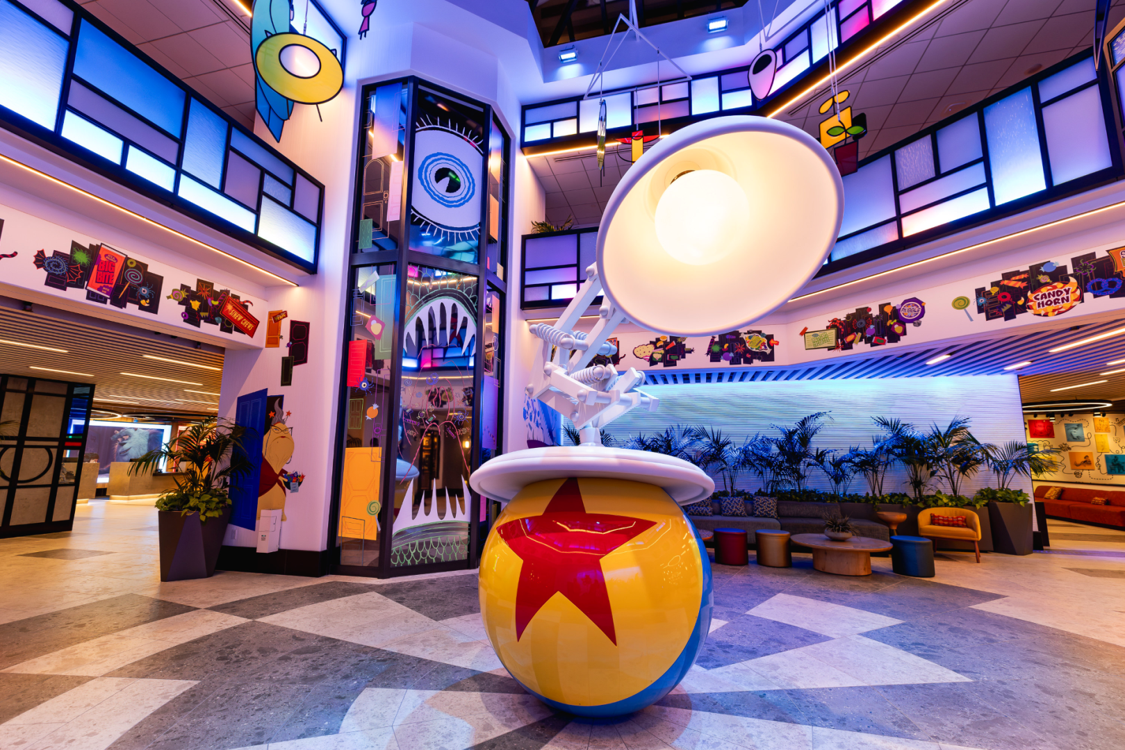 Monsters, Inc. Halloween artwork around the Luxo Ball and lamp in the Pixar Place Hotel lobby at Disneyland Resort