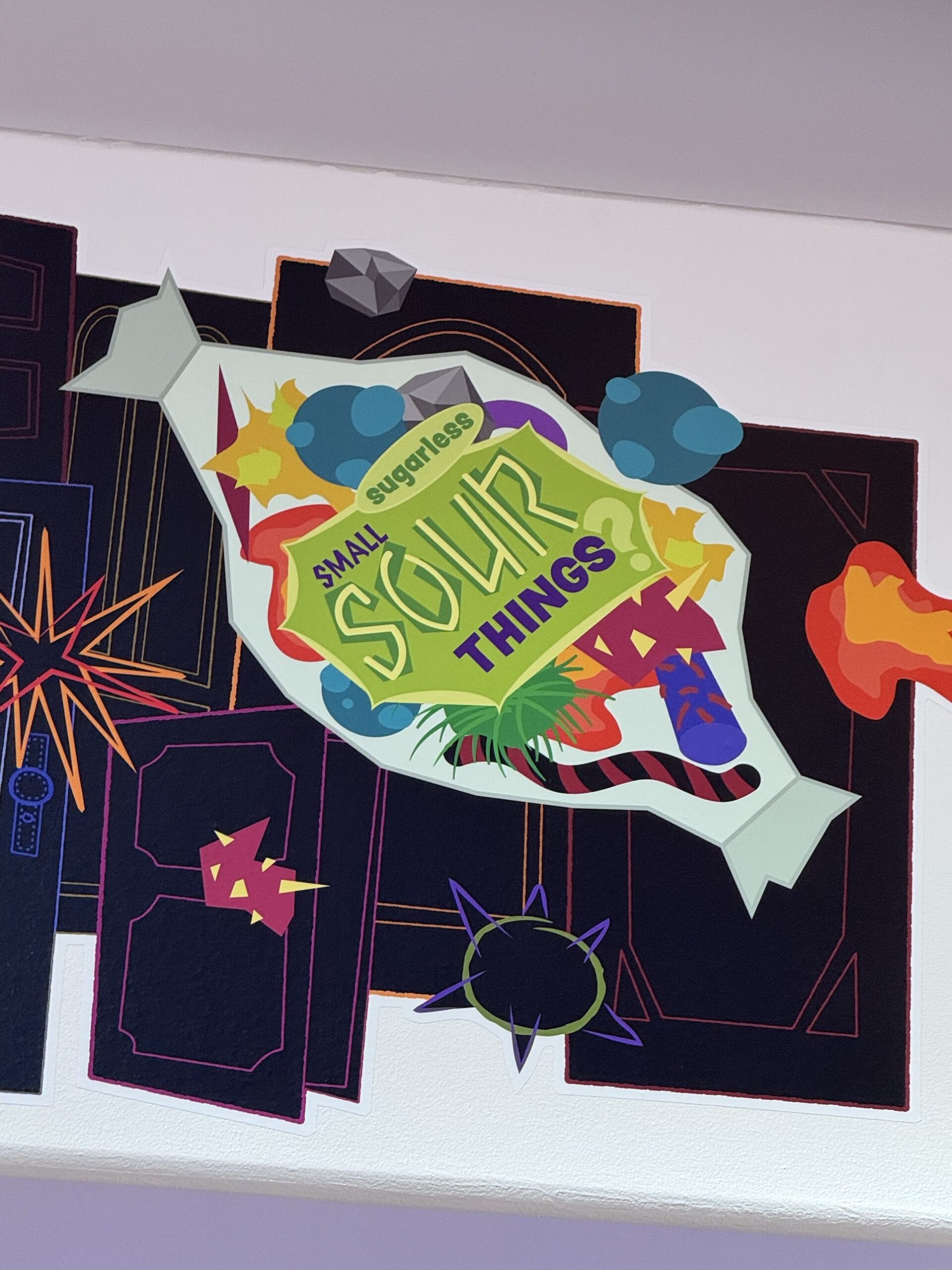 Sugarless Small Sour Things candy wrapper artwork at Pixar Place Hotel
