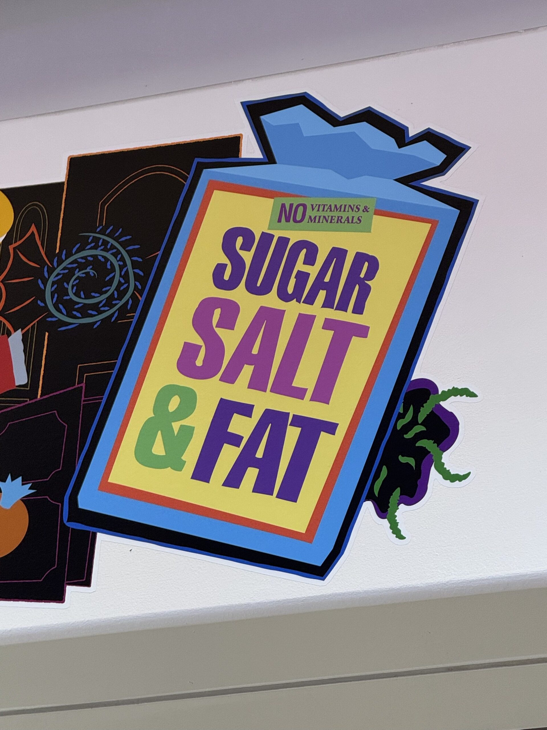 Sugar Salt and Fat candy bag artwork marked No Vitamins and Minerals at Pixar Place Hotel