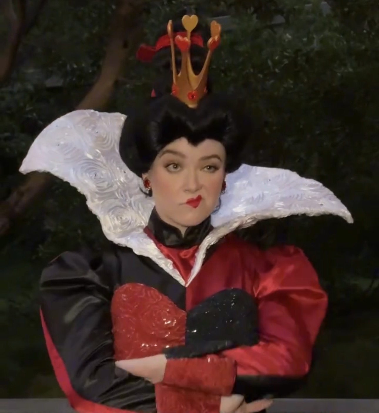 The Queen of Hearts face character with her arms crossed at D23 Night at Oogie Boogie Bash