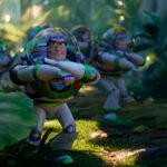 Several Buzz Lightyear toys in a leafy outdoor setting in Disney and Pixar's Toy Story 5
