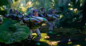 Several Buzz Lightyear toys in a leafy outdoor setting in Disney and Pixar's Toy Story 5