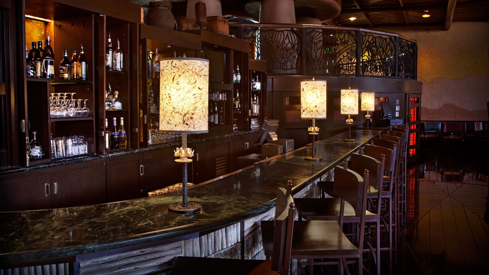 Formal bar with stool-chairs and lamps