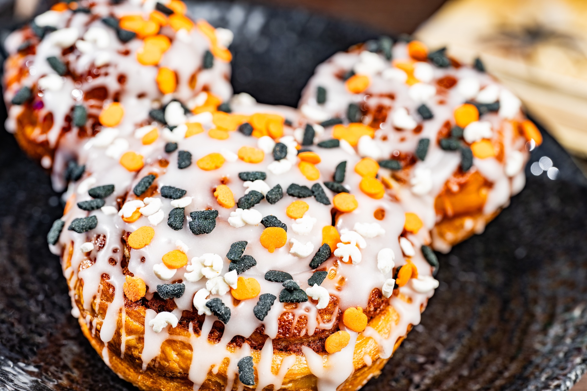 Mickey Cinnamon Roll with Halloween sprinkles at Main Street Bakery, Magic Kingdom
