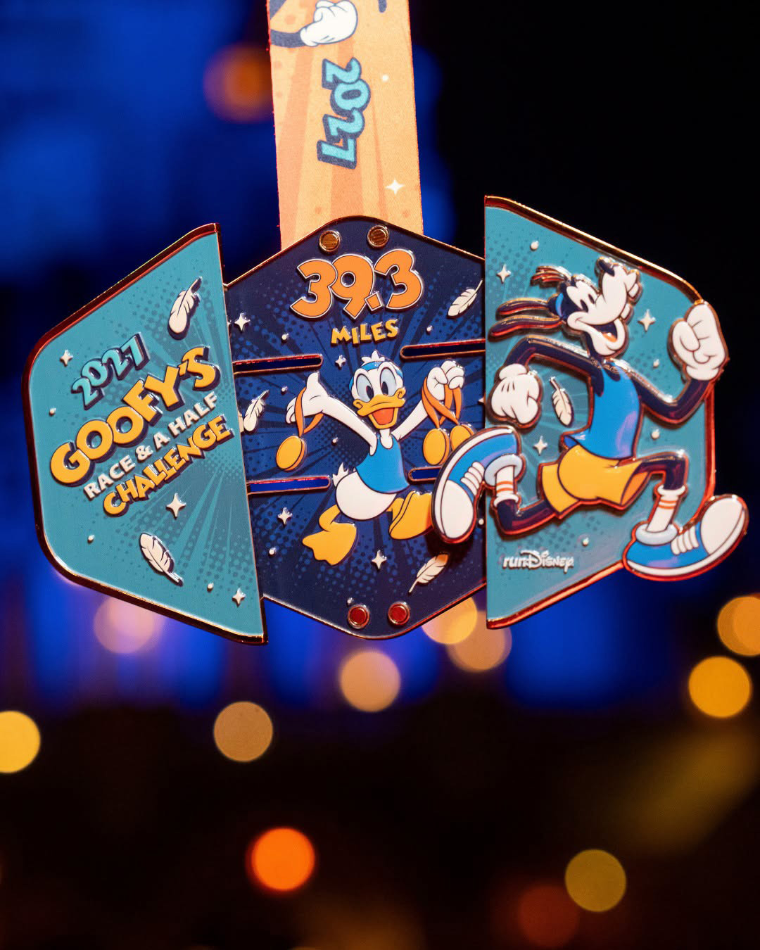 2027 Goofy's Race and a Half Challenge medal opened to show 39.3 miles and Donald Duck