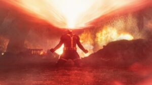 A red optic blast lights up a battlefield in a still from Marvel Studios' Avengers: Doomsday
