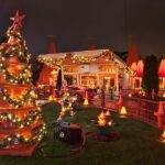The Cozy Cone Motel in Cars Land decorated for the holidays with garlands, lights and a traffic cone Christmas tree