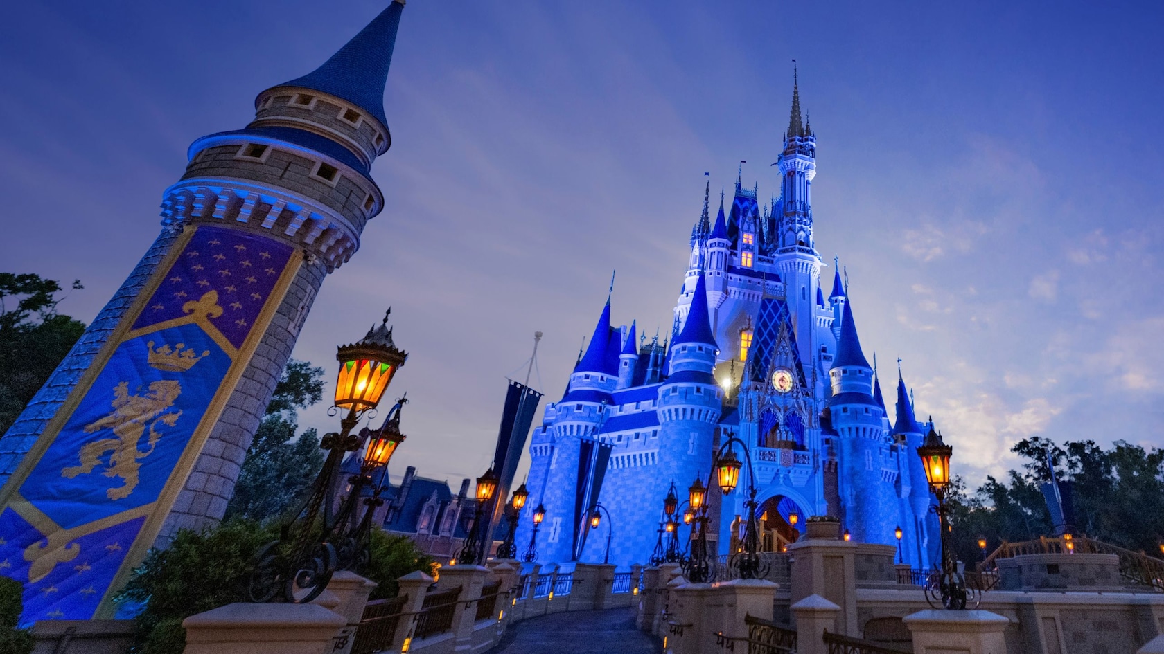 Cinderella Castle at Magic Kingdom lit up at dusk
