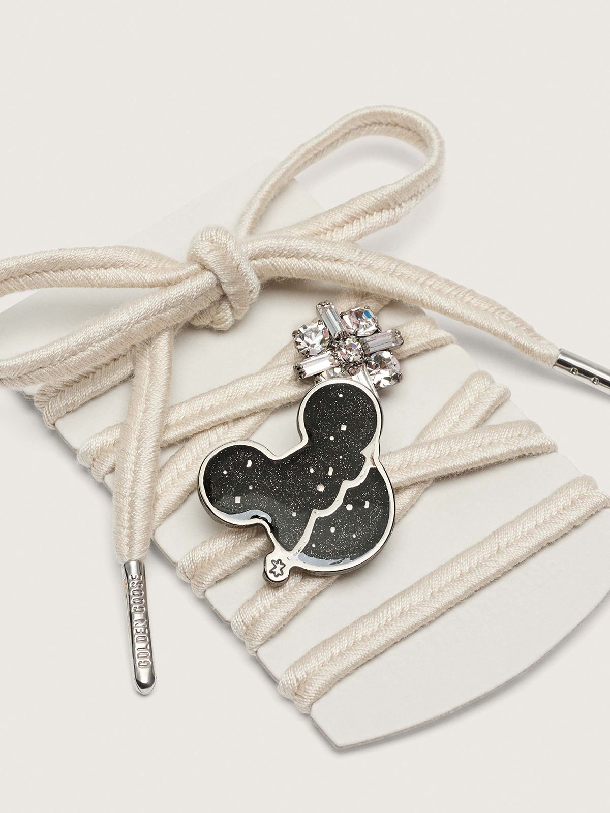 Galaxy-print shoelaces and Mickey and Friends accessories from Golden Goose