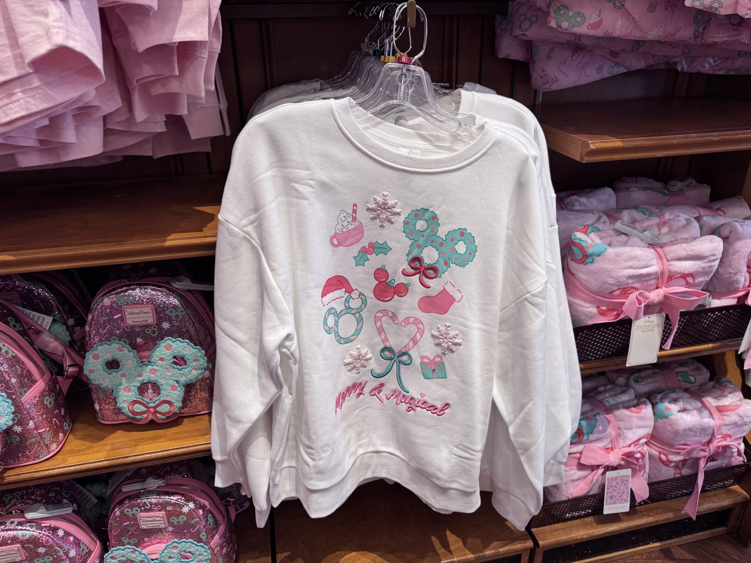White Merry and Magical sweatshirt with cocoa, wreath Mickey, candy cane heart and stocking graphics
