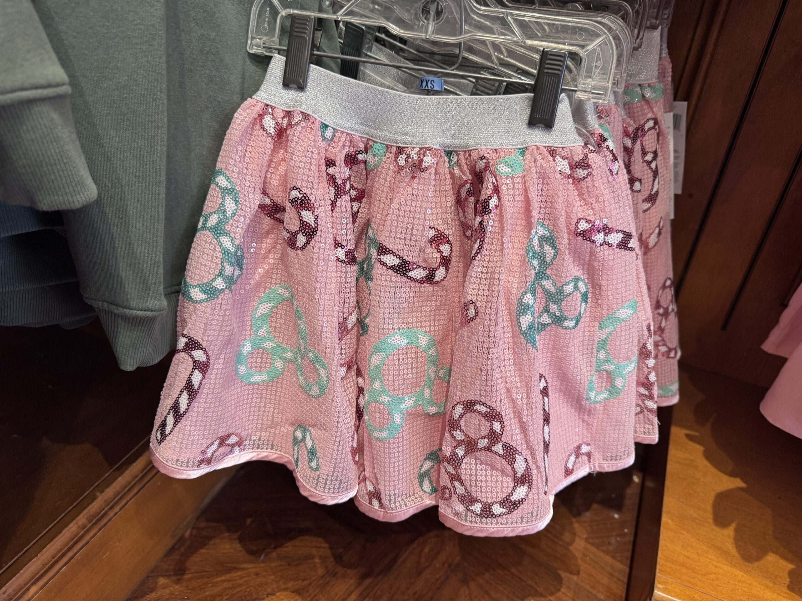 Pink sequin skirt with candy cane and mint Mickey icon patterns and a silver waistband