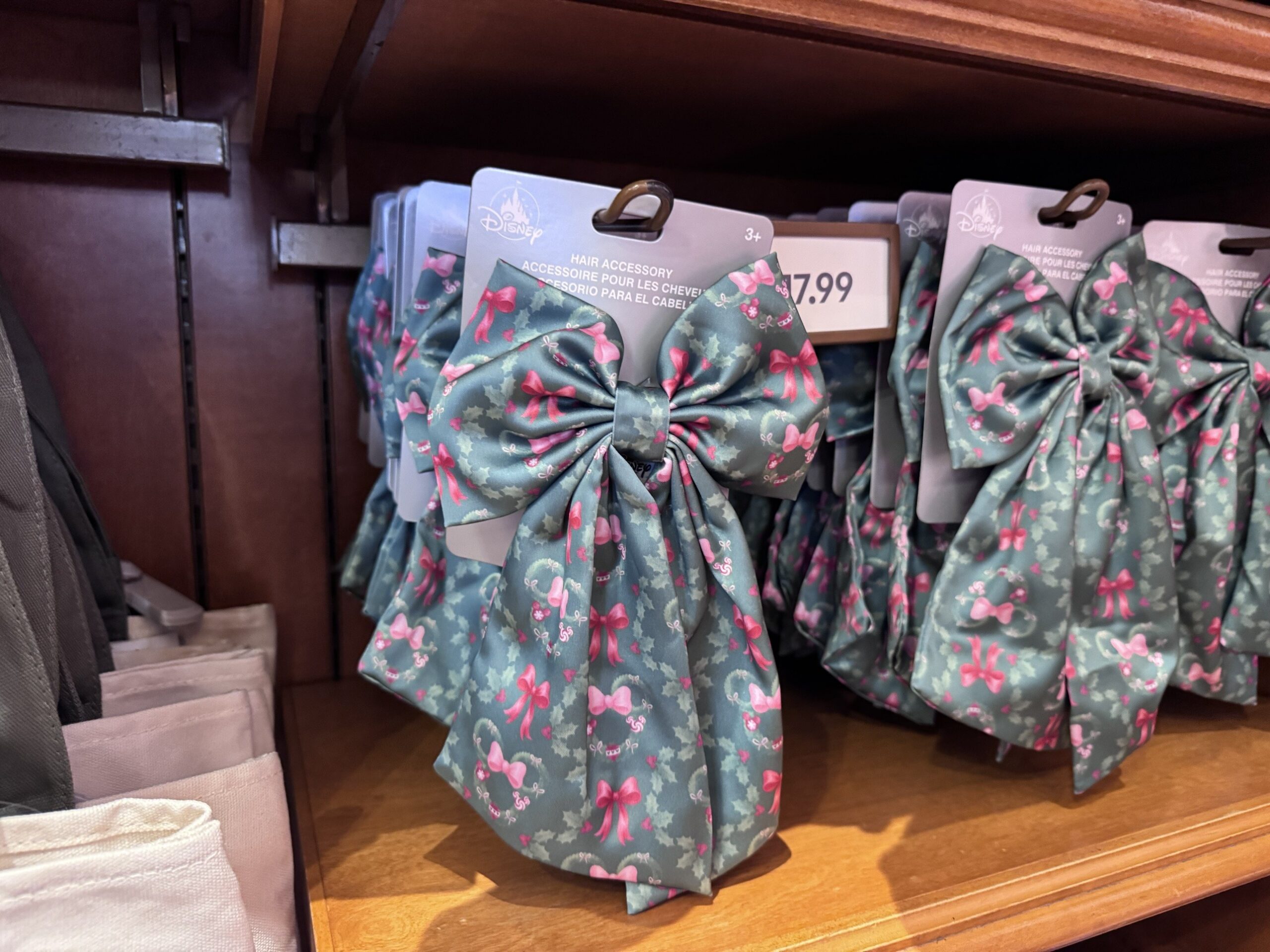 Sage green satin hair bows printed with pink bows and Minnie wreaths