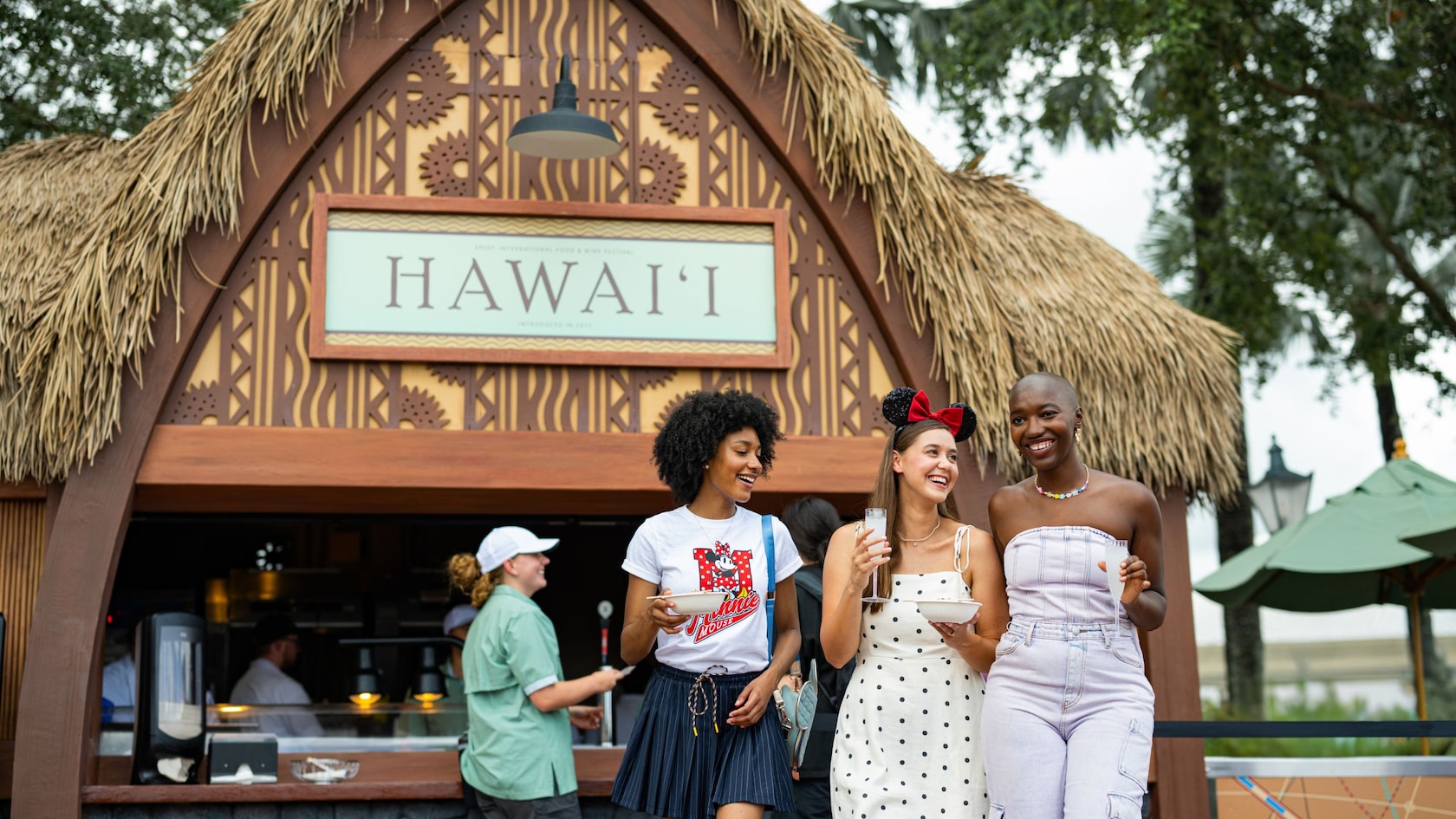 Guests enjoying food and drinks around World Showcase at EPCOT