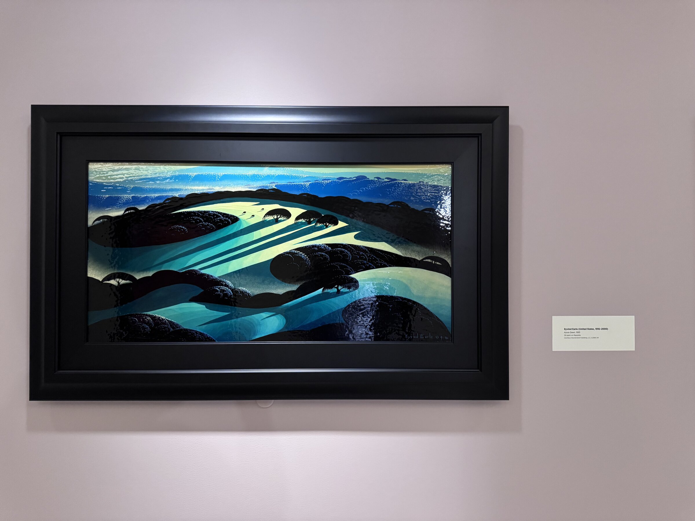 Eyvind Earle's Azure Dawn, a 1993 oil painting of rolling blue-green hills with dark tree clusters