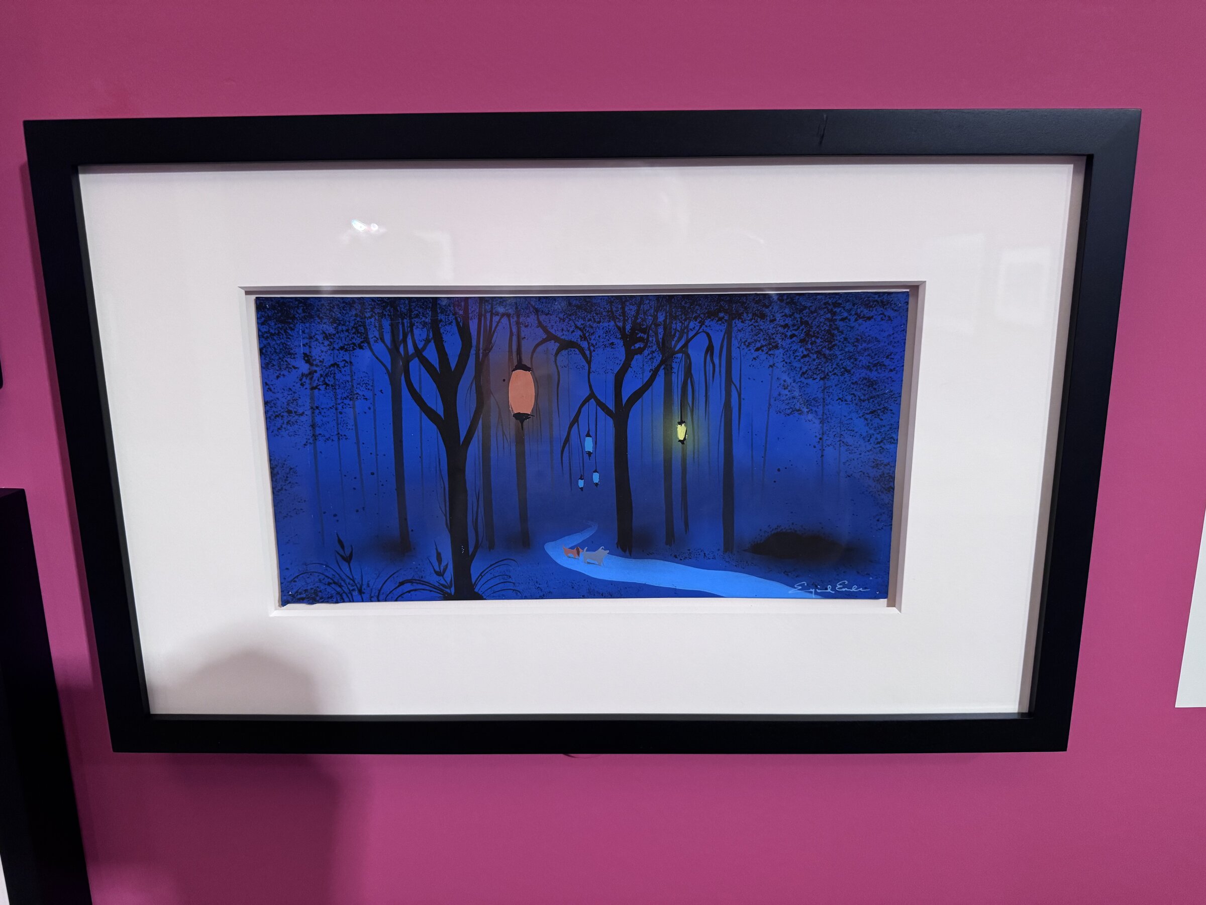 Eyvind Earle concept art for Lady and the Tramp showing a glowing lantern hanging among deep blue night trees