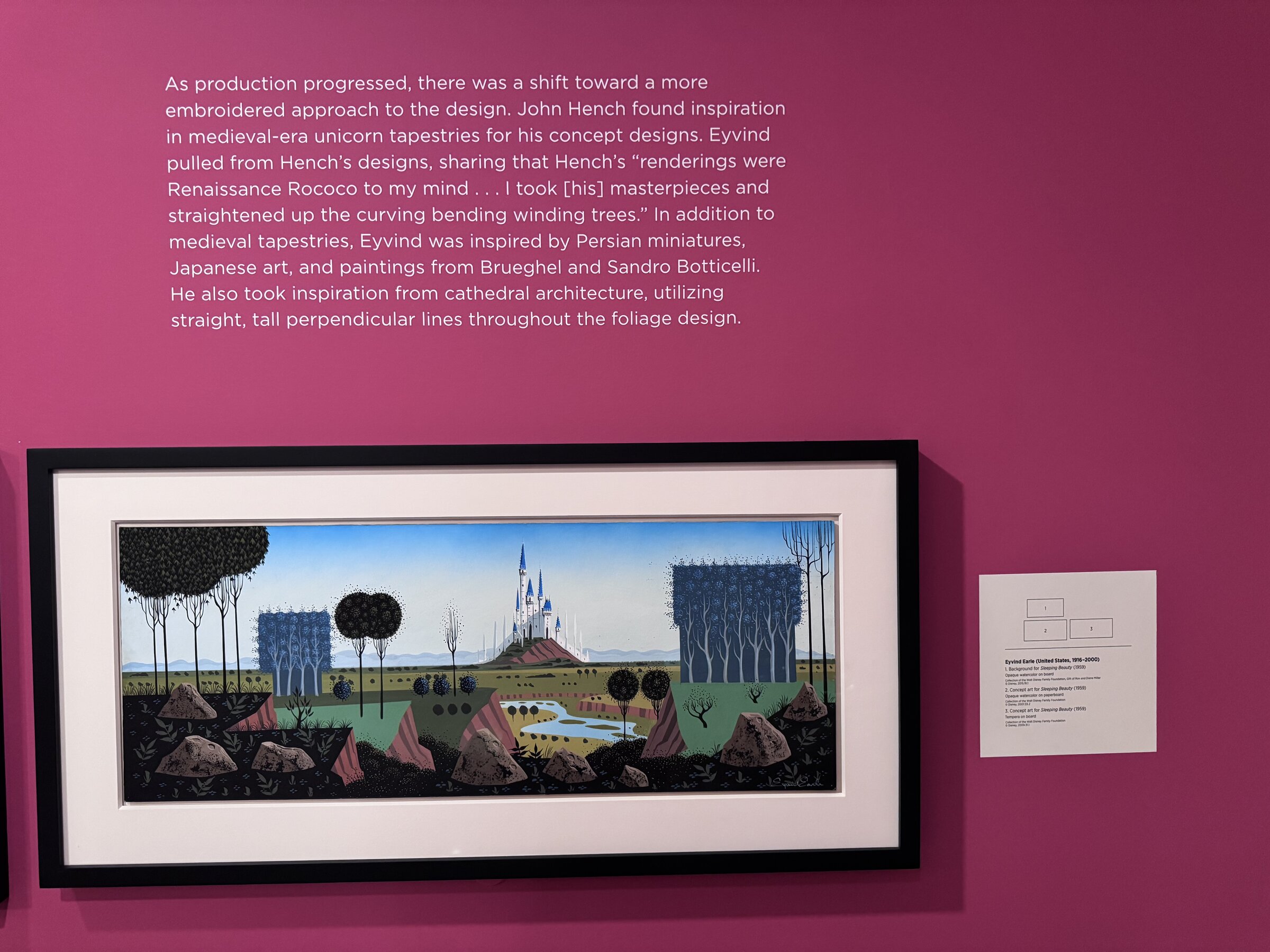 Eyvind Earle concept art for Sleeping Beauty showing a distant castle between tall, squared-off trees, below wall text about John Hench and medieval tapestries