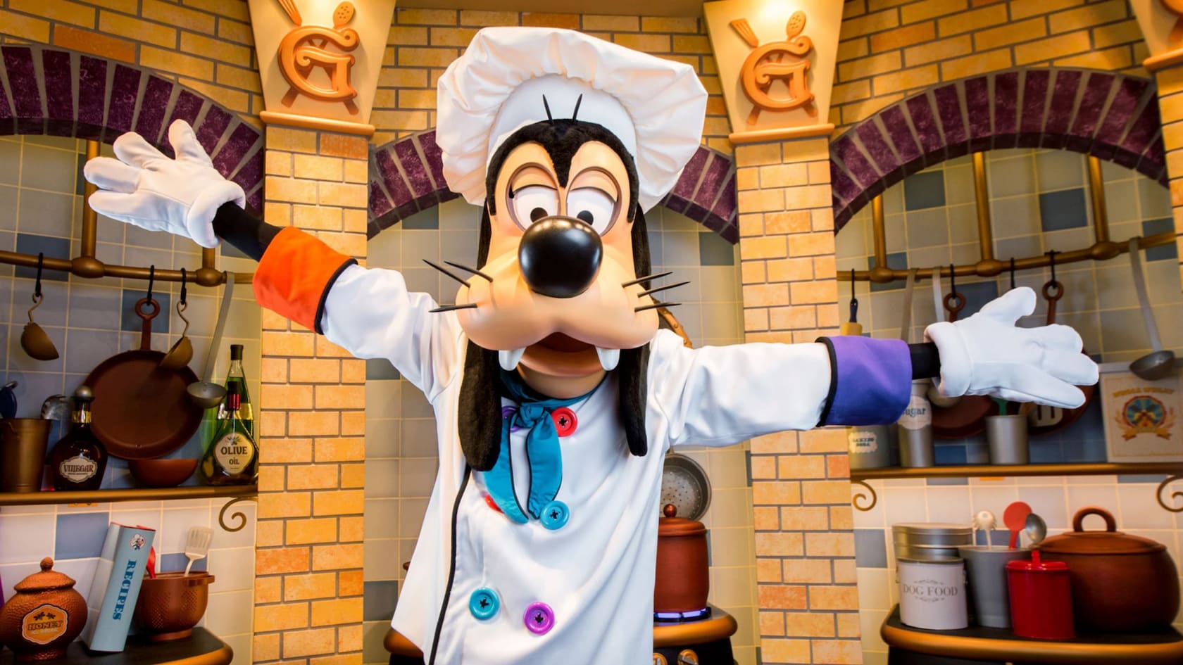 Goofy in a chef's hat and jacket at Goofy's Kitchen in the Disneyland Hotel