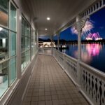 The Grand Floridian veranda over Seven Seas Lagoon at night