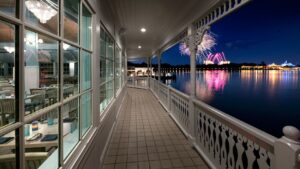 The Grand Floridian veranda over Seven Seas Lagoon at night