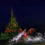 Castle of Magical Dreams at Hong Kong Disneyland lit at night during Disney Halloween Time