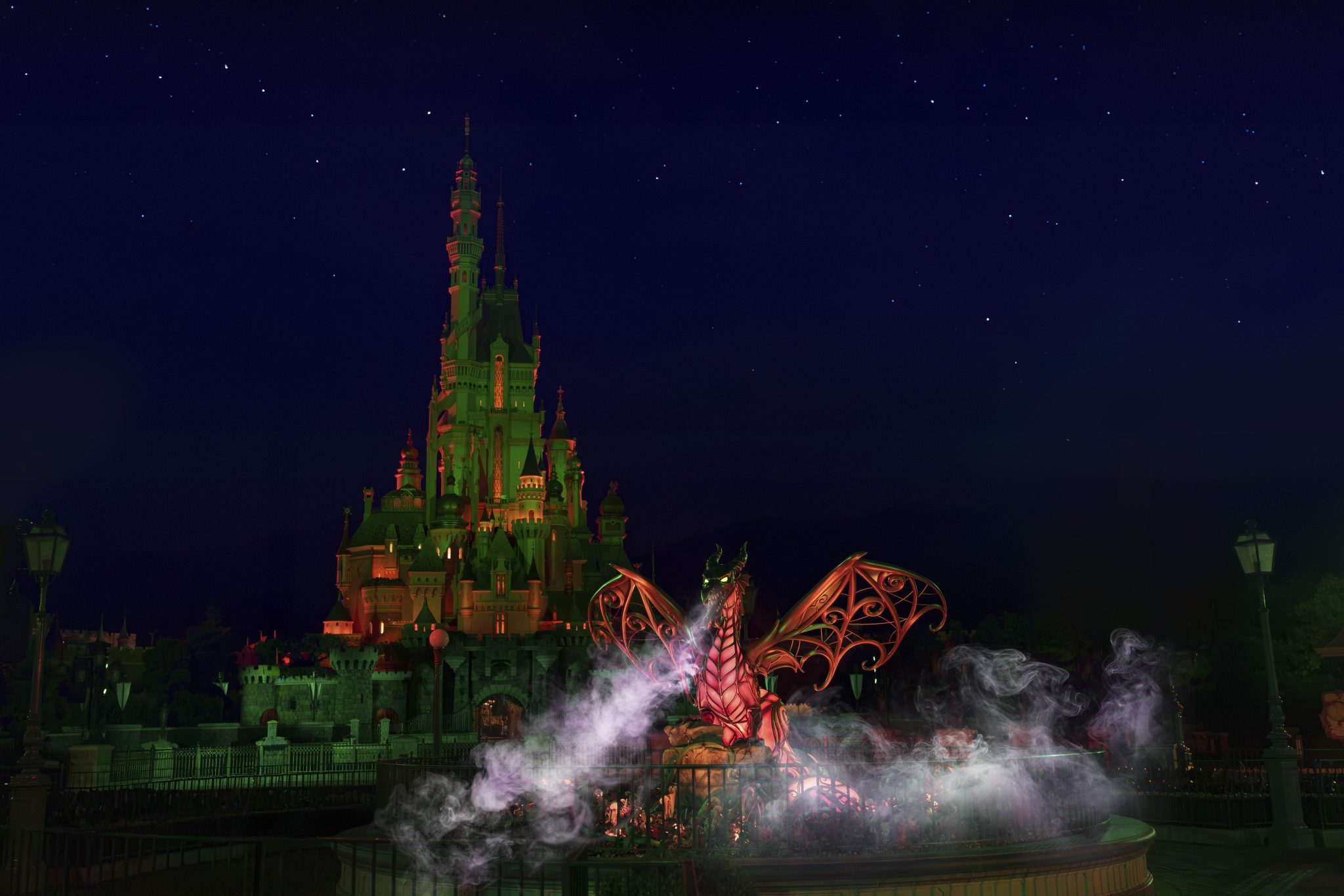 Castle of Magical Dreams at Hong Kong Disneyland lit at night during Disney Halloween Time
