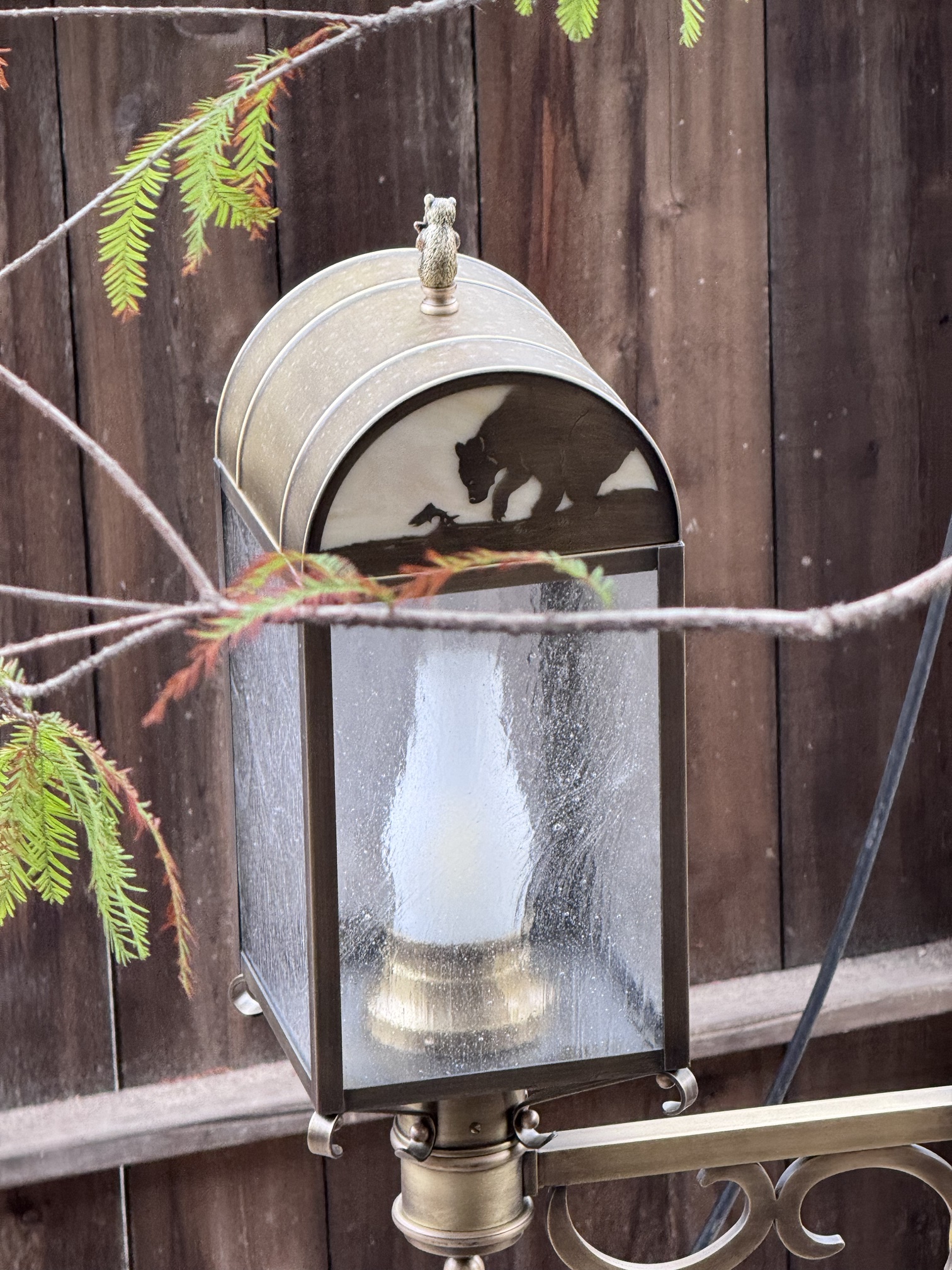 A Hungry Bear Barbecue Jamboree lantern showing a bear reaching for a fish along a stream