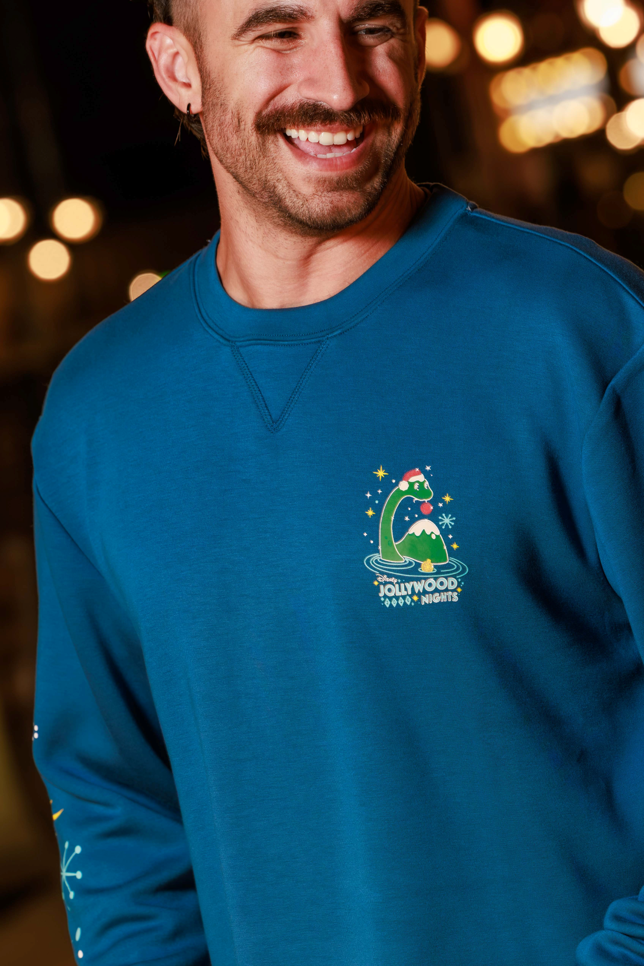 2026 Jollywood Nights Pullover with Gertie and holiday ornaments on the front