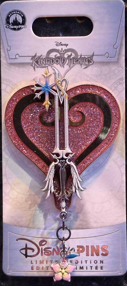 Kingdom Hearts Oathkeeper keyblade limited edition pin on a pink glitter heart for the November 2026 Disneyland release