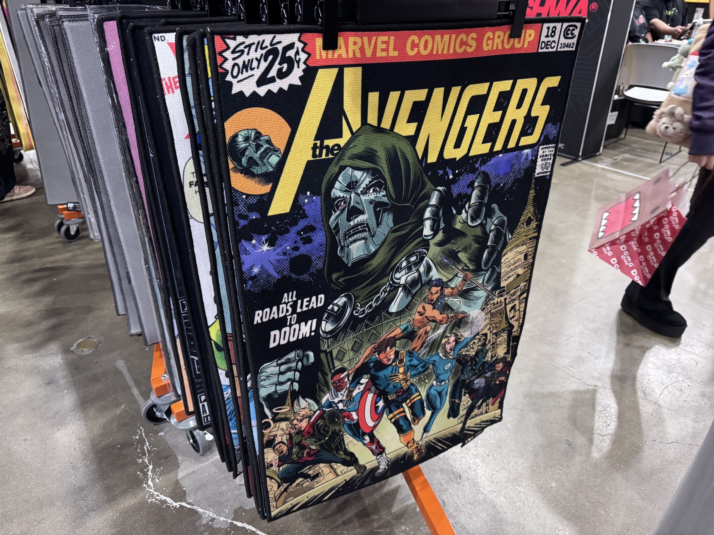 A rug printed with an Avengers comic cover showing Doctor Doom and the words All Roads Lead To Doom