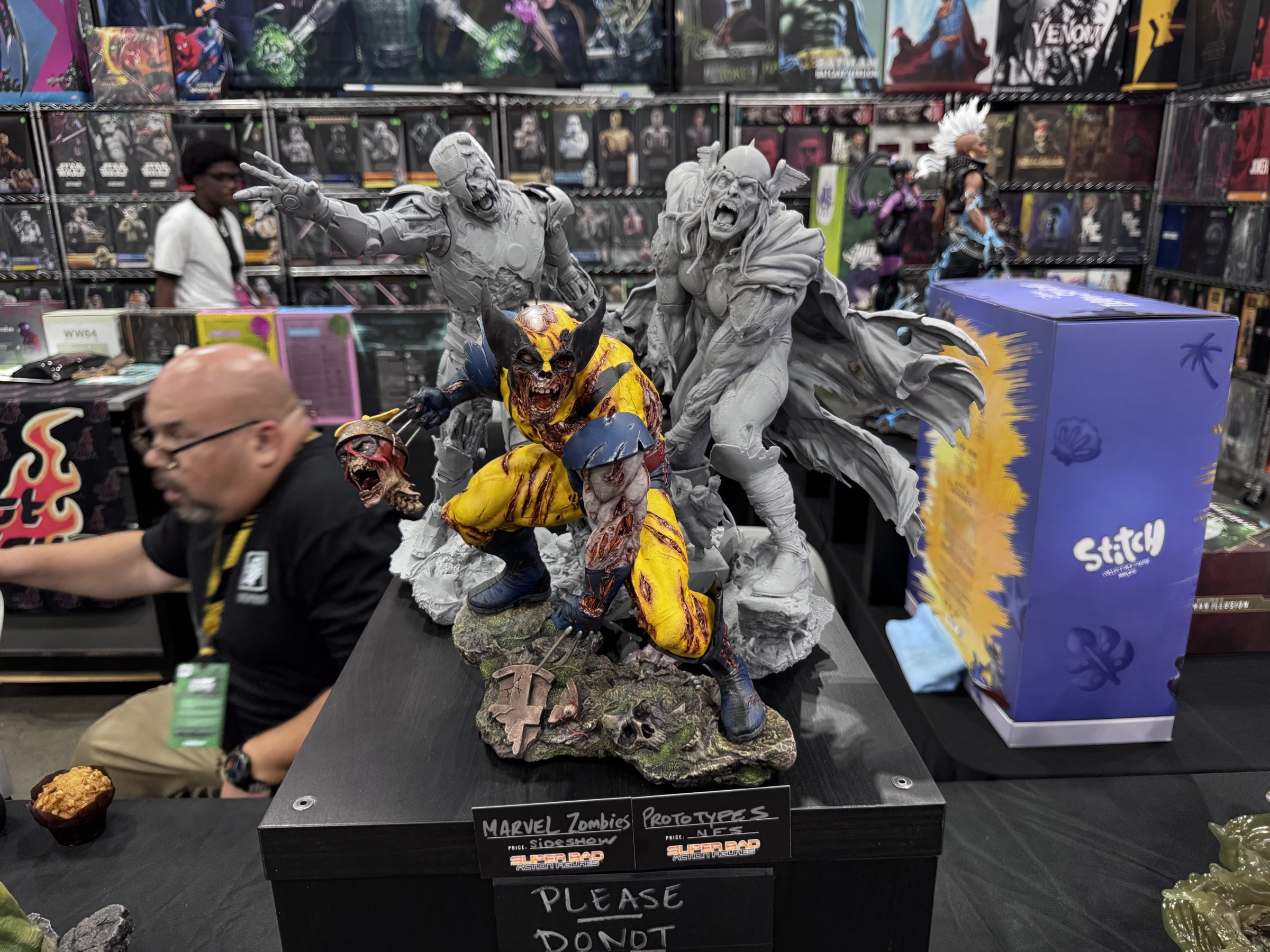 A painted zombie Wolverine statue and unpainted gray Marvel Zombies prototypes