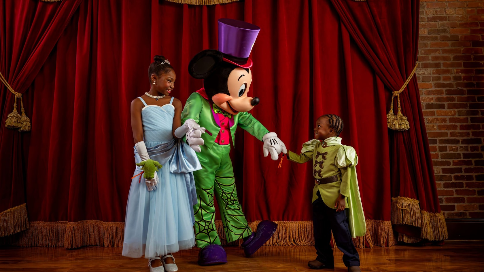 Mickey Mouse in costume greets guests at Mickey's Not-So-Scary Halloween Party